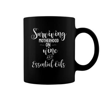 Surviving Motherhood On Wine & Essential Oils Coffee Mug | Mazezy