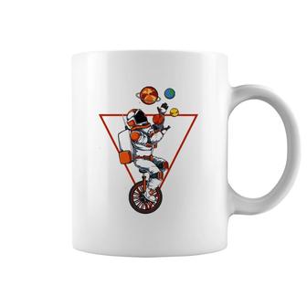 Space Astronaut Bicycle Juggling Planets Cosmic Astronomy Coffee Mug | Mazezy