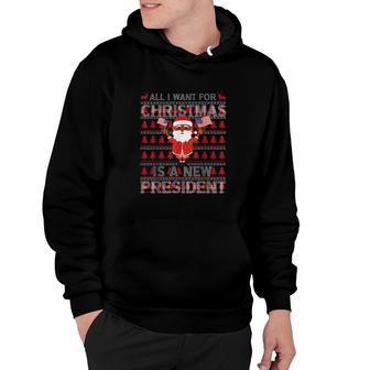 Santa Clau Hold American Flag All I Want For Christmas Is A New President Ugly Christmas Sweat Hoodie | Mazezy