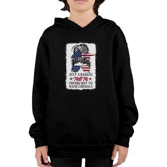 Funny Just A Badass Mom Trying Not To Raise Liberals Youth Hoodie | Mazezy