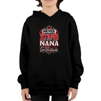 Never Stand Between A Nana And Her Grandkids Funny Grandmother Youth Hoodie | Mazezy
