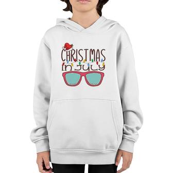 Christmas In July Santa Hat Sunglasses Summer Beach Vacation Youth Hoodie | Mazezy