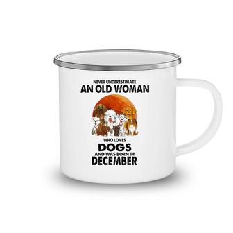 Never Underestimate An Old Woman Who Loves Dogs December Camping Mug | Mazezy