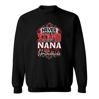 Never Stand Between A Nana And Her Grandkids Funny Grandmother Sweatshirt | Mazezy