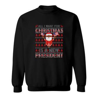 Santa Clau Hold American Flag All I Want For Christmas Is A New President Ugly Christmas Sweat Sweatshirt | Mazezy