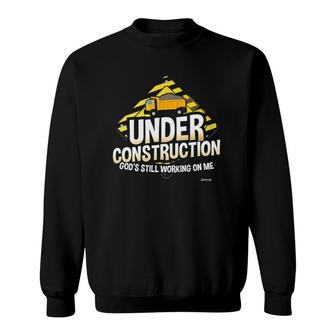 Under Construction God's Still Working On Me Christian Sweatshirt | Mazezy