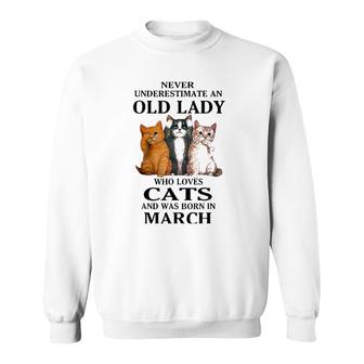 Never Underestimate An Old Lady Who Loves Cats Born In March Sweatshirt | Mazezy AU