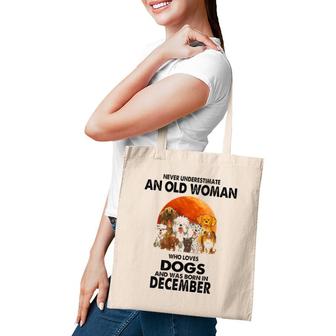 Never Underestimate An Old Woman Who Loves Dogs December Tote Bag | Mazezy