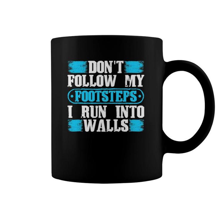 Don't Follow My Footsteps I Run Into Walls Funny Sarcastic Coffee Mug