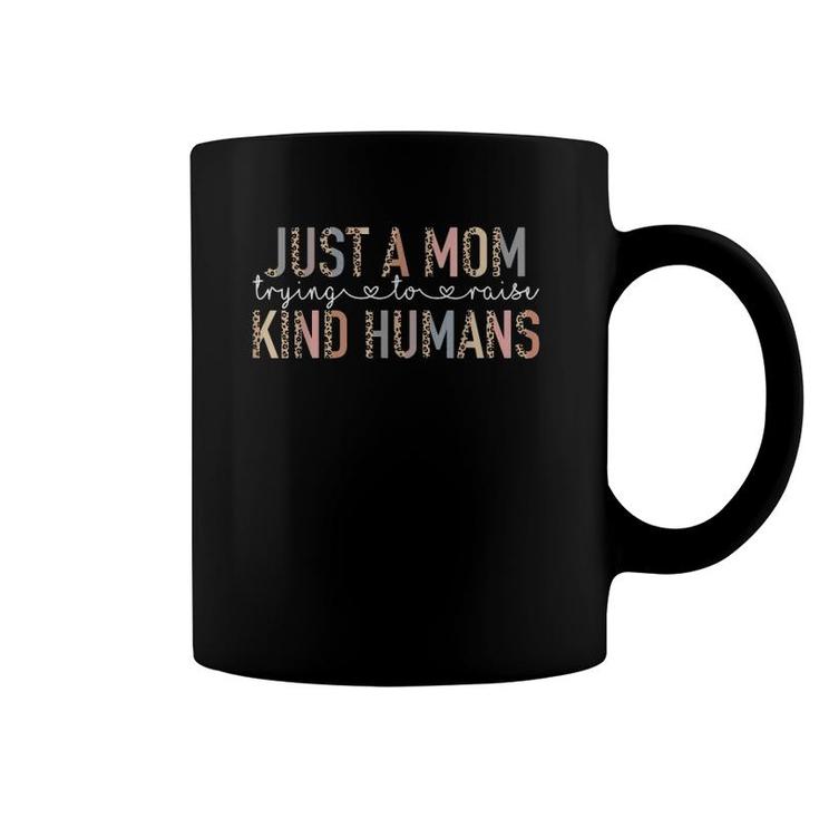 Funny Leopard Just A Mom Trying To Raise Kind Humans Mama Coffee Mug