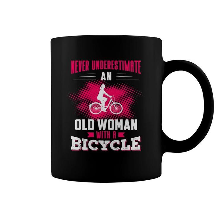 Never Underestimate An Old Woman With A Bicycle Pink Coffee Mug