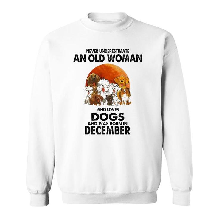 Never Underestimate An Old Woman Who Loves Dogs December Sweatshirt