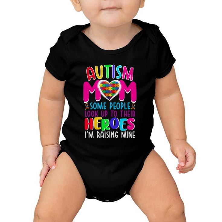 Autism Mom Some People Look Up To Their Heroes I'm Raising Mine Autism Awareness Puzzle Pieces Heart Ribbon Mother’S Day Gift Baby Onesie